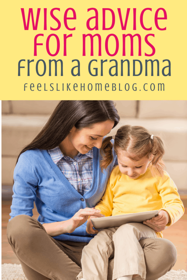 mom and young girl looking at a book