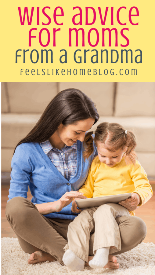 mom and young girl looking at a book