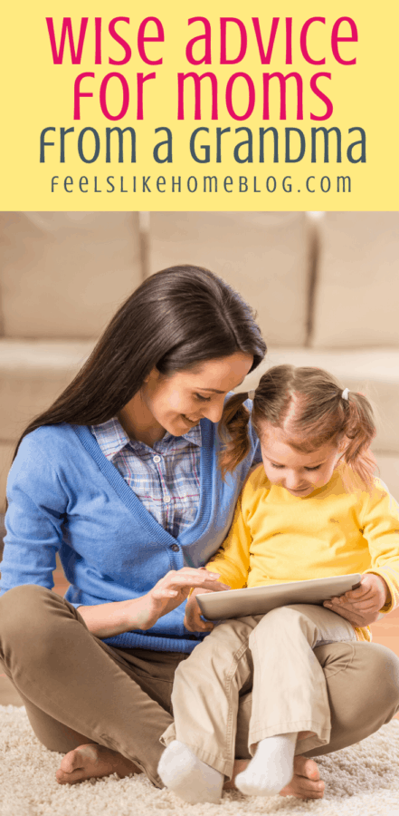 mom and daughter looking at a book