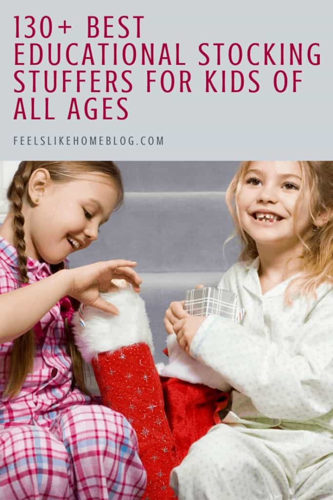 Two girls holding Christmas stockings